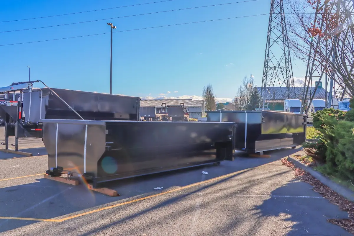Roll-off dumpster ready for waste disposal at job site for 3 Yard Dumpster Rental in Oatfield